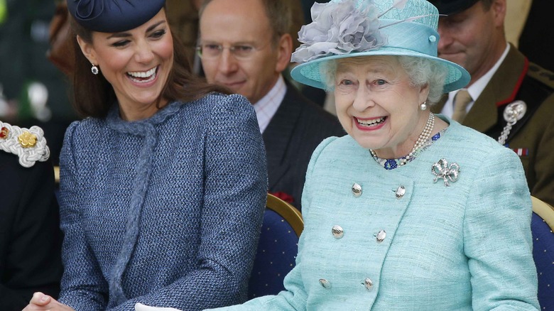 Queen Elizabeth with hands out