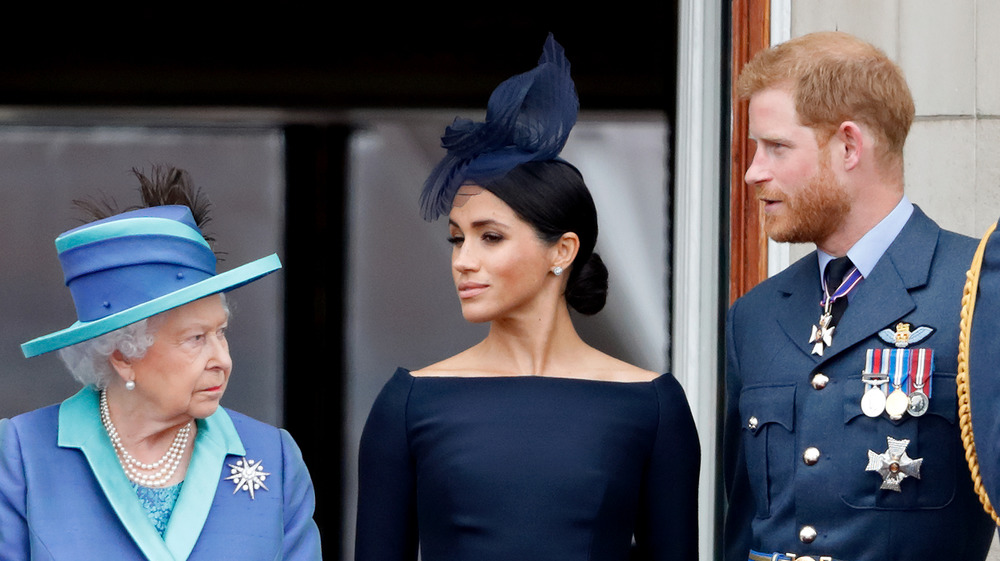 Queen Elizabeth looks sternly at Meghan and Harry