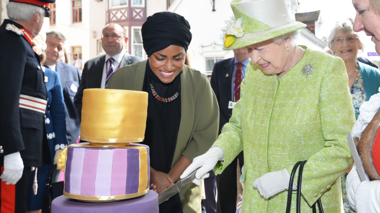 Queen Elizabeth II receiving her 90th birthday cake