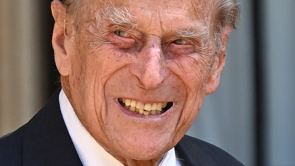 Prince Philip poses for a photo