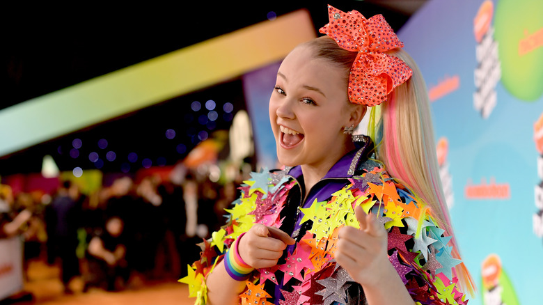 JoJo Siwa posing on the orange carpet