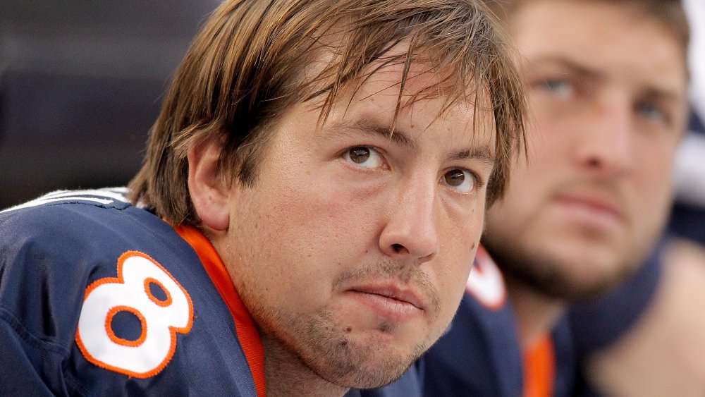 Kyle Orton and Tim Tebow of the Denver Broncos, both looking up