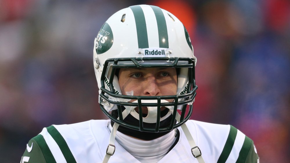 Tim Tebow looking discouraged while playing for the New York Jets