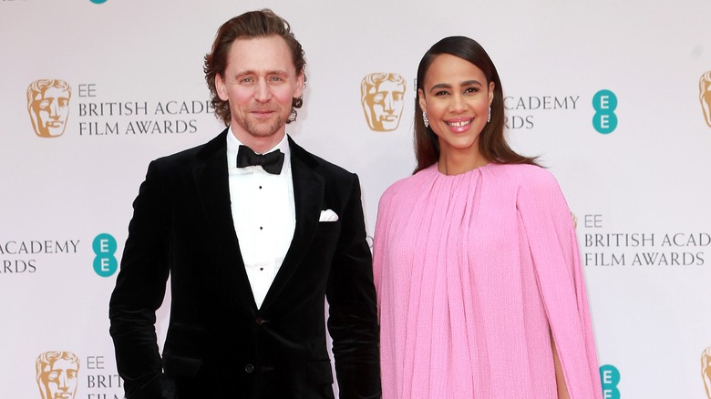 Tom Hiddleston and Zawe Ashton smiling