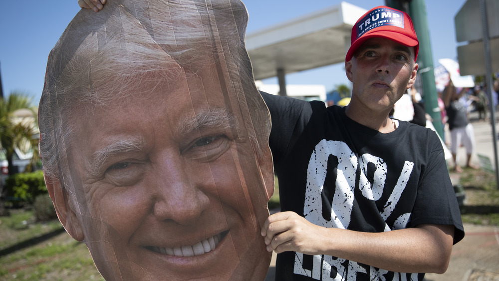 Trump supporter holding a Donald Trump cut-out