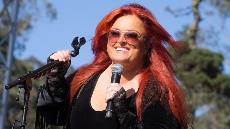 Wynonna Judd singing smiling