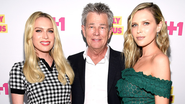 David Foster posing with his daughters Erin and Sara Foster