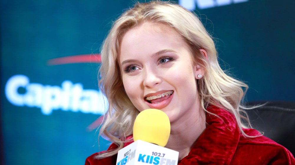 Zara Larsson speaking into a microphone at KiisFM