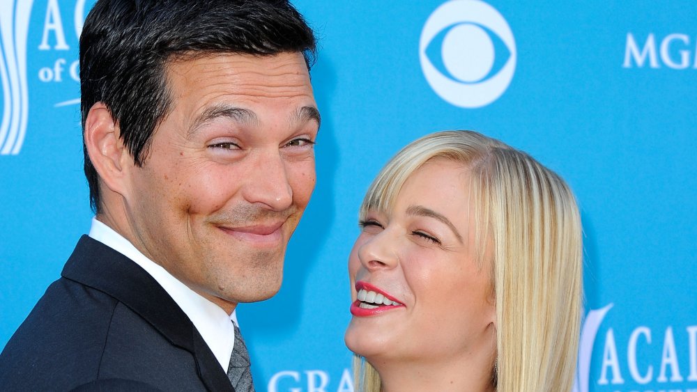 Eddie Cibrian smirking, LeeAnn Rimes laughing