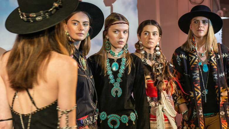 Models posing at London Fashion Week