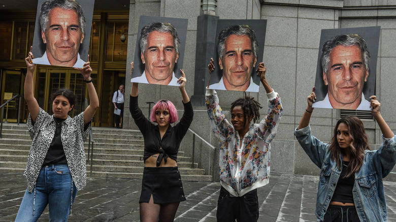 People protesting against Jeffrey Epstein