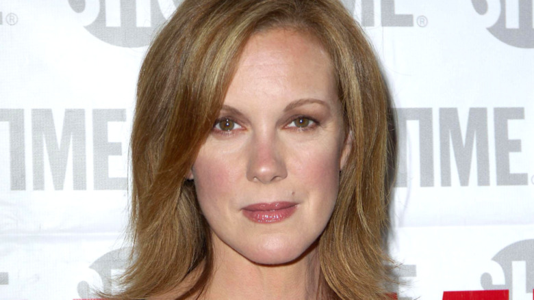 Elizabeth Perkins smirking