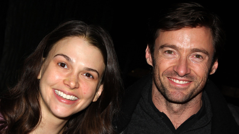 Sutton Foster with long brown hair and Hugh Jackman with short brown hair