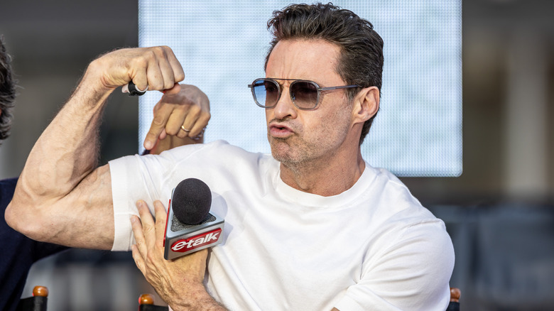 Hugh Jackman flexing