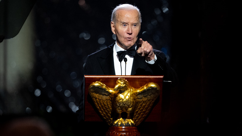 Joe Biden at a podium pointing his finger