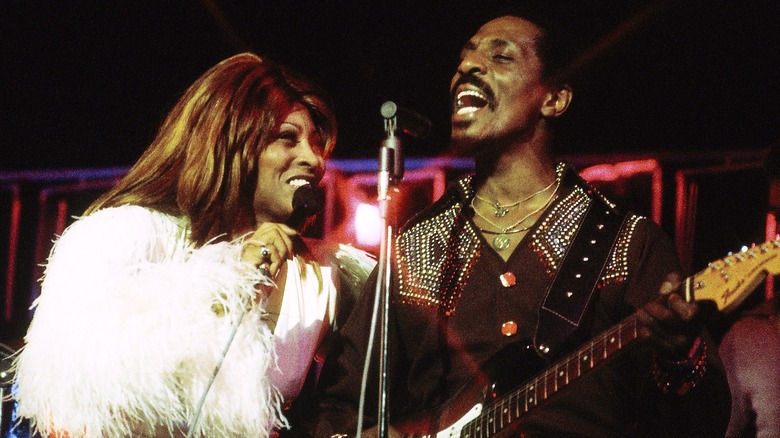 Ike Turner performing onstage with Tina Turner