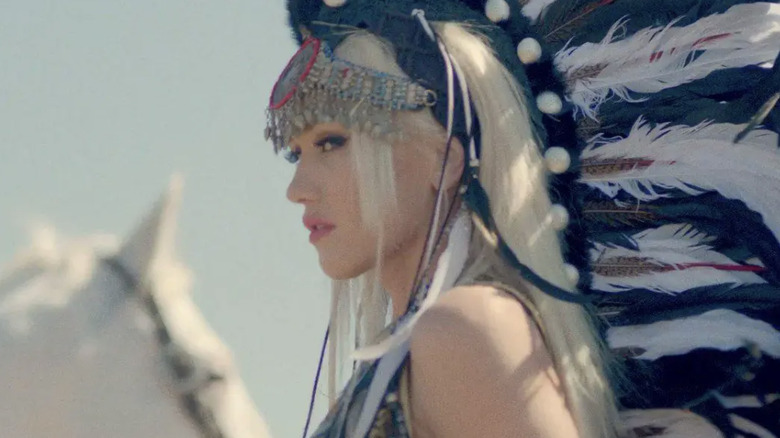 Gwen Stefani posing sideways with Native American hairstyle