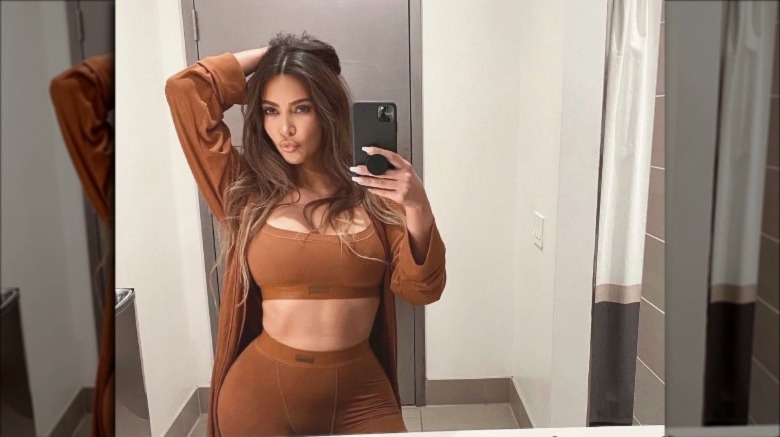 Kim Kardashian posing in SKIMS shape wear