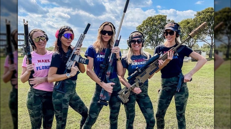 Lara Trump stands with four friends friends in camo with guns