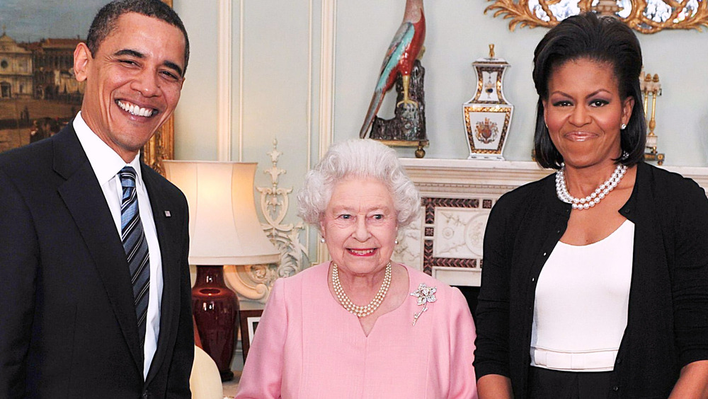 Barack Obama, Queen Elizabeth II, and Michelle Obama posing together