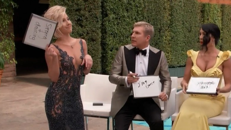 Savannah Chrisley holding up mini whiteboard