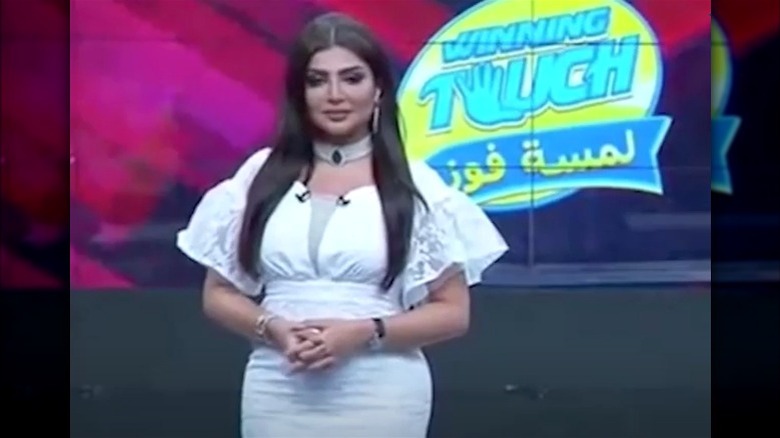 Amal Al-Awadhi wearing white dress