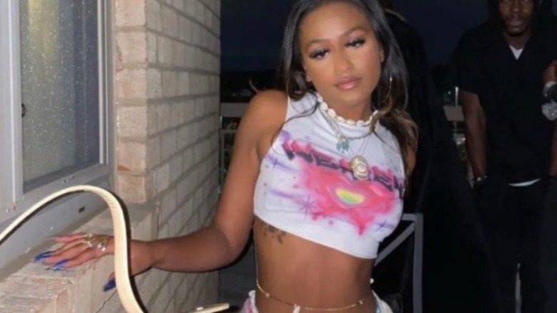 A woman wearing a crop top and bikini bottoms, who is alleged to be Sasha Obama.