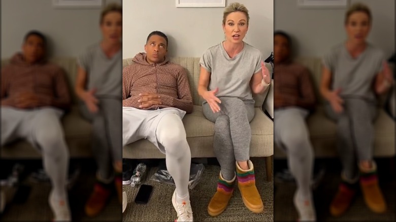 T.J. Holmes, Amy Robach seated on couch