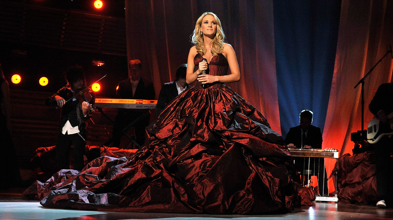 Carrie Underwood wearing red gown