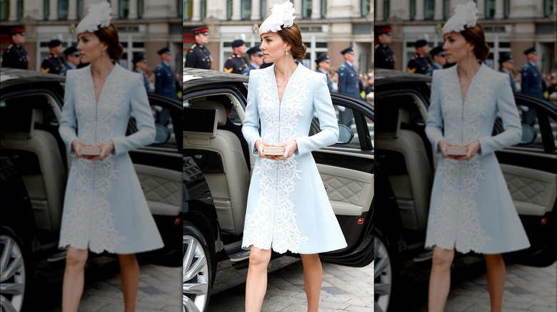 Kate Middleton wearing a pale blue dress and a white hat