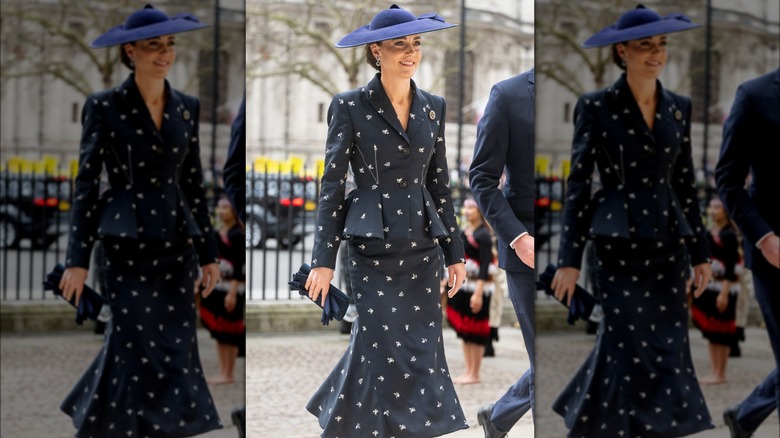 Kate Middleton wearing a navy blue skirt suit