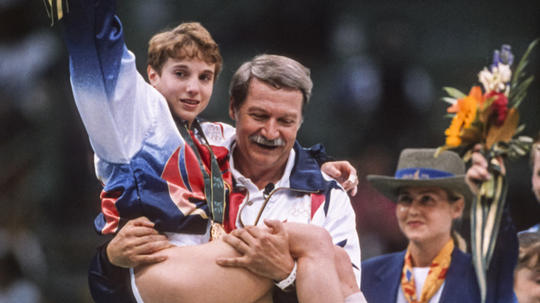 Kerri Strug being carried by Bela Karolyi