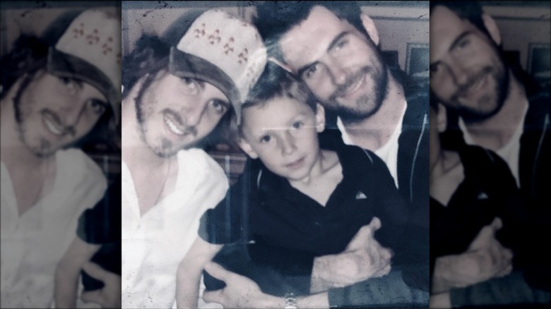 Adam Levine with his brothers