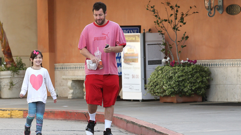 Sunny Sandler and Adam Sandler walking together