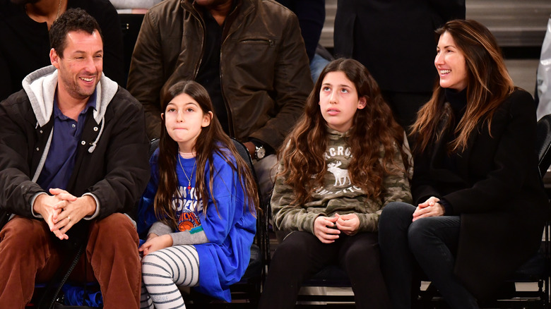 Adam, Sunny, Sadie, and Jackie Sandler sitting together