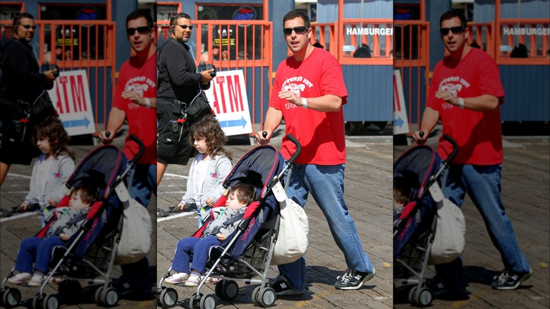 Adam Sandler pushing Sunny in stroller while walking with Sadie