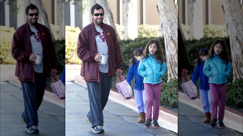 Adam Sandler walking with daughters