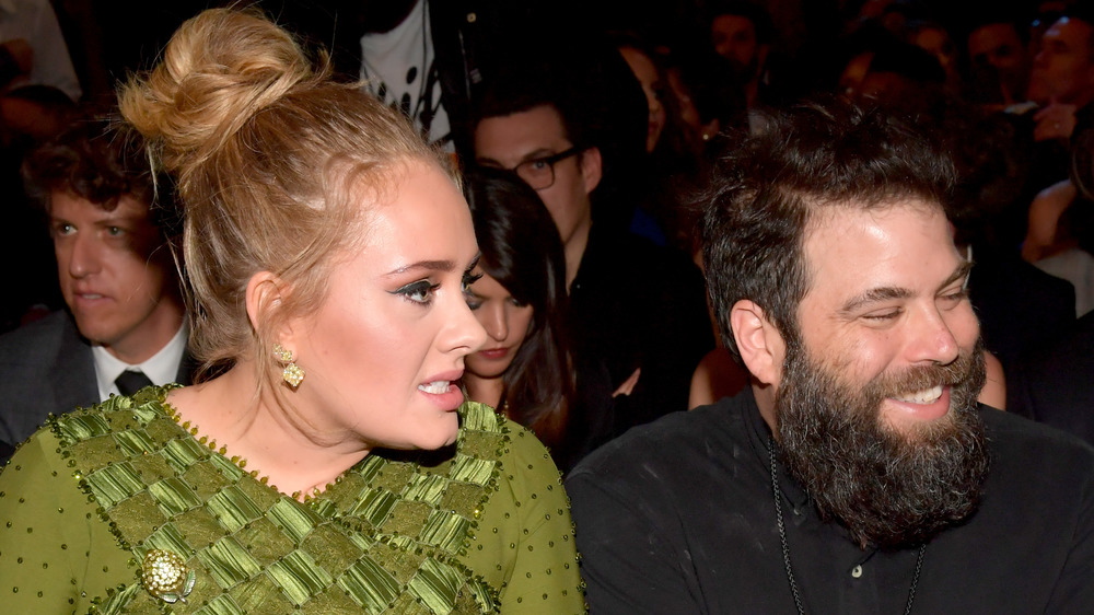 Adele and Simon Konecki talking at the Grammy Awards