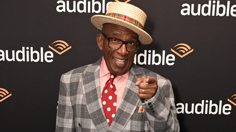 Al Roker smiling and pointing