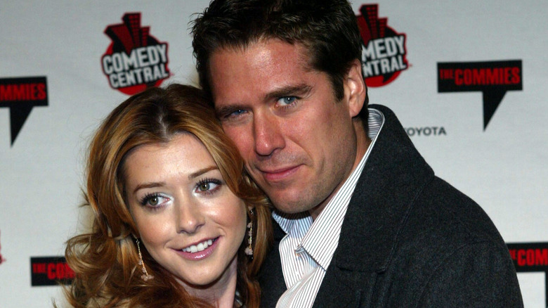 Alyson Hannigan and Alexis Denisof embracing