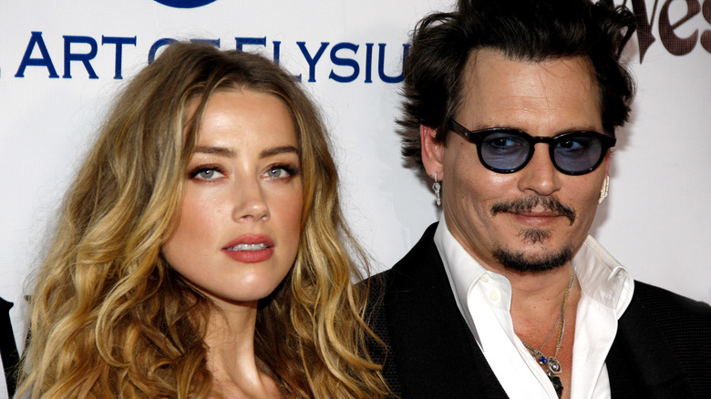 Amber Heard and Johnny Depp posing