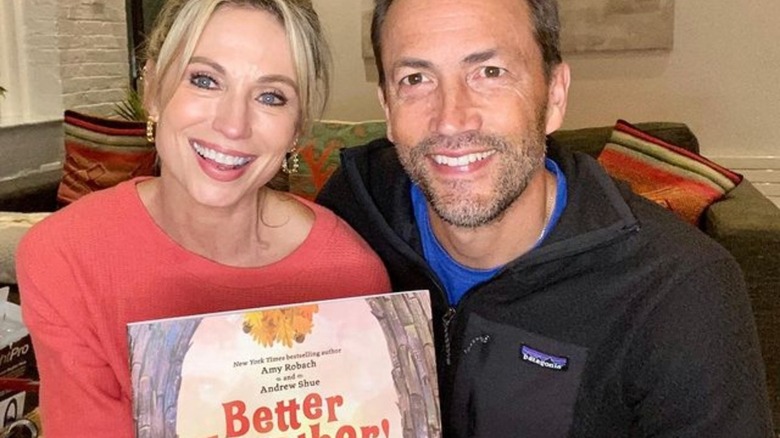 Amy Robach, Andrew Shue, posing with book