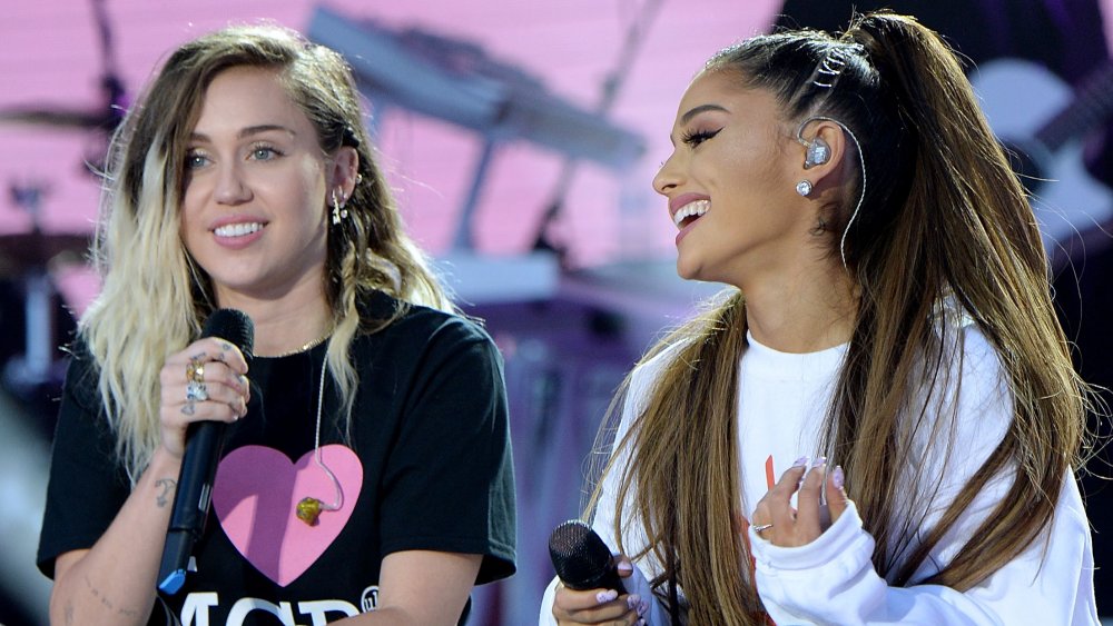 Miley Cyrus and Ariana Grande during an interview