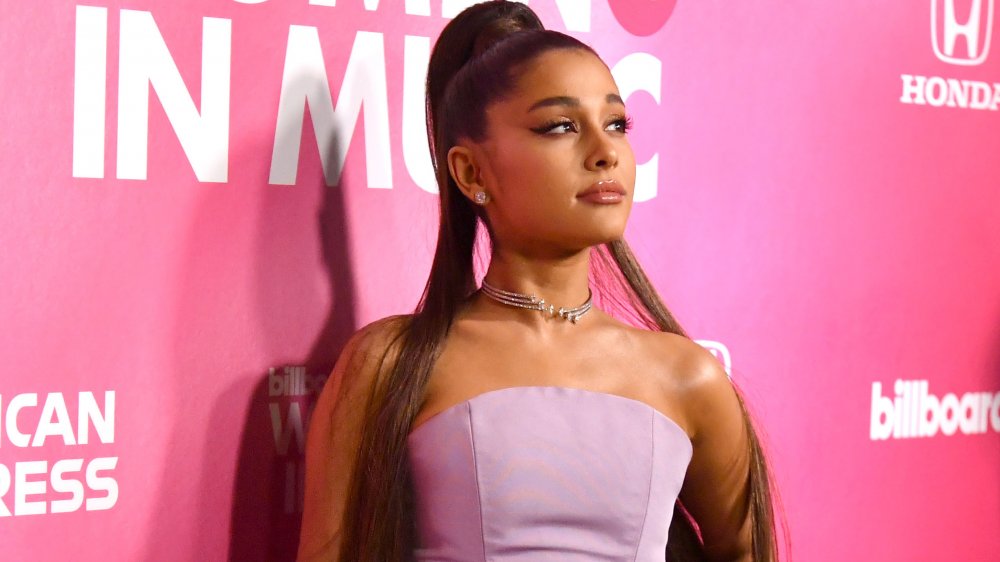 Ariana Grande in a pink sleeveless dress