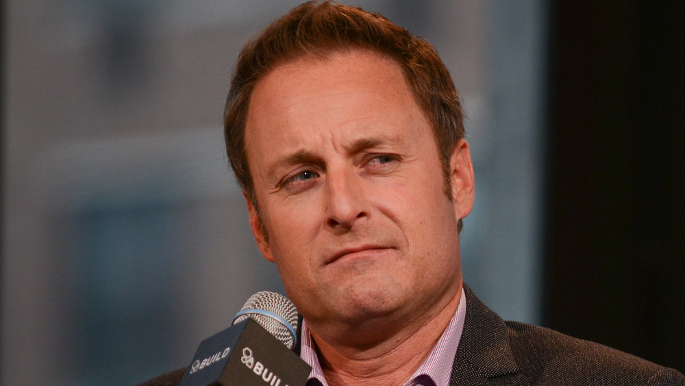 Chris Harrison holding a microphone