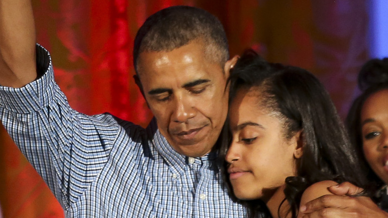 Barack Obama hugs Malia Obama