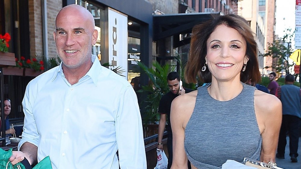 Dennis Shields and Bethenny Frankel smiling and walking together