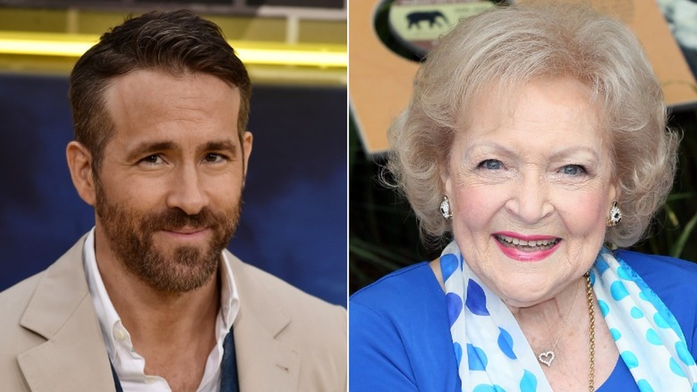 Betty White and Ryan Reynolds posing for pictures 