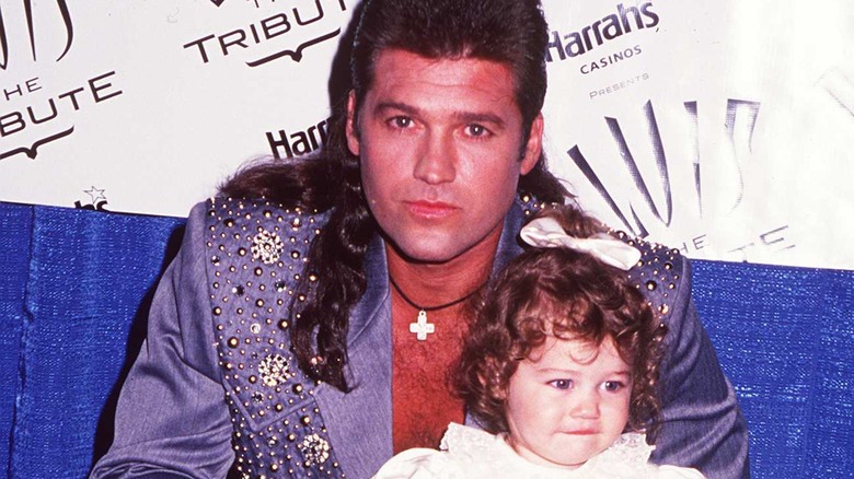 Billy Ray Cyrus, toddler Miley Cyrus, 1994 photo 