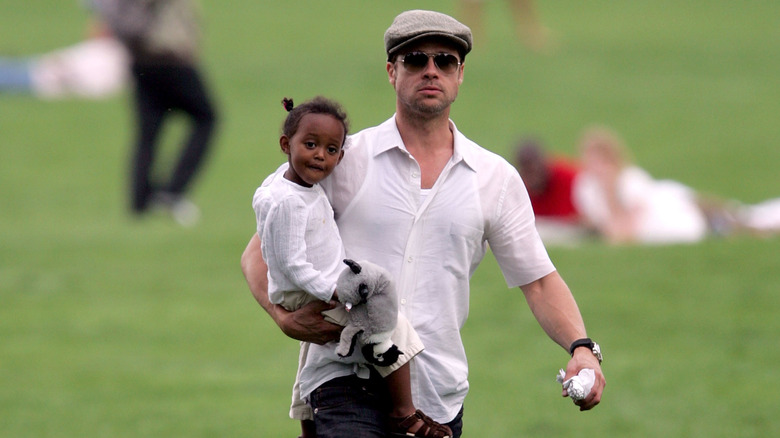 Brad Pitt holding Zahara Marley Jolie in Central Park